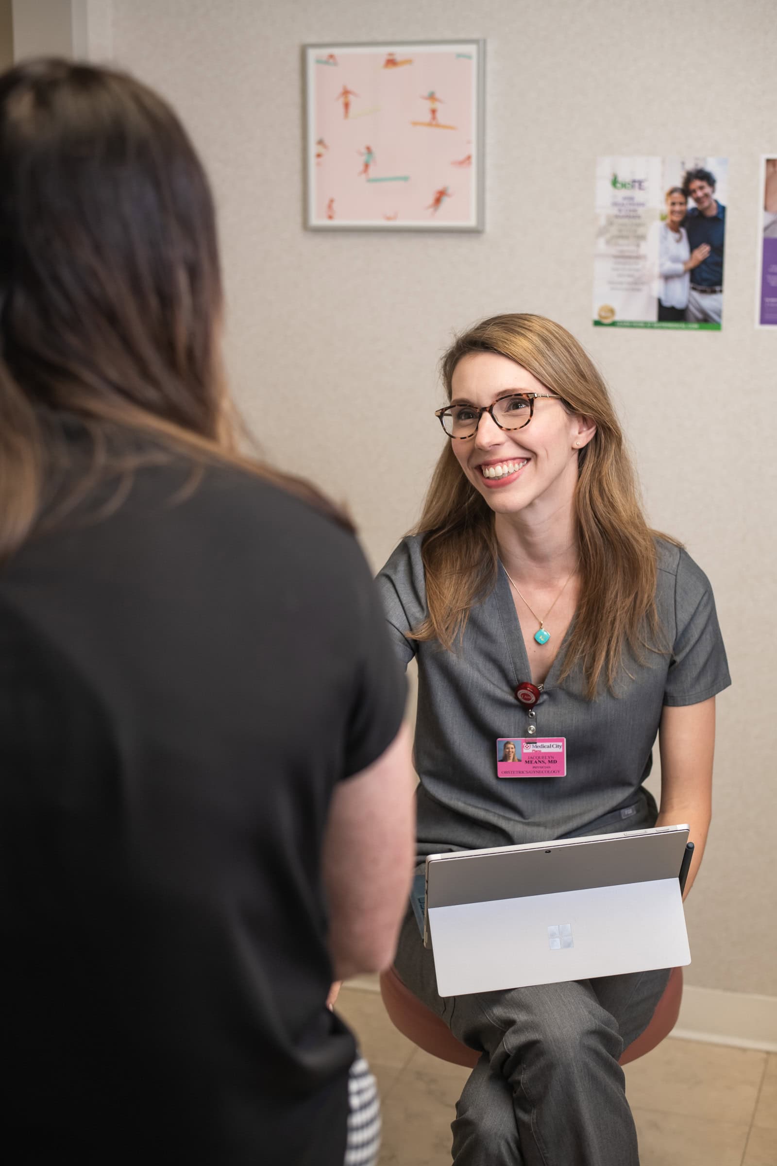 Doctor consulting with a patient in a clinic, patient-and-provider commercial medical photography in Dallas, Texas by David Loi Studios
