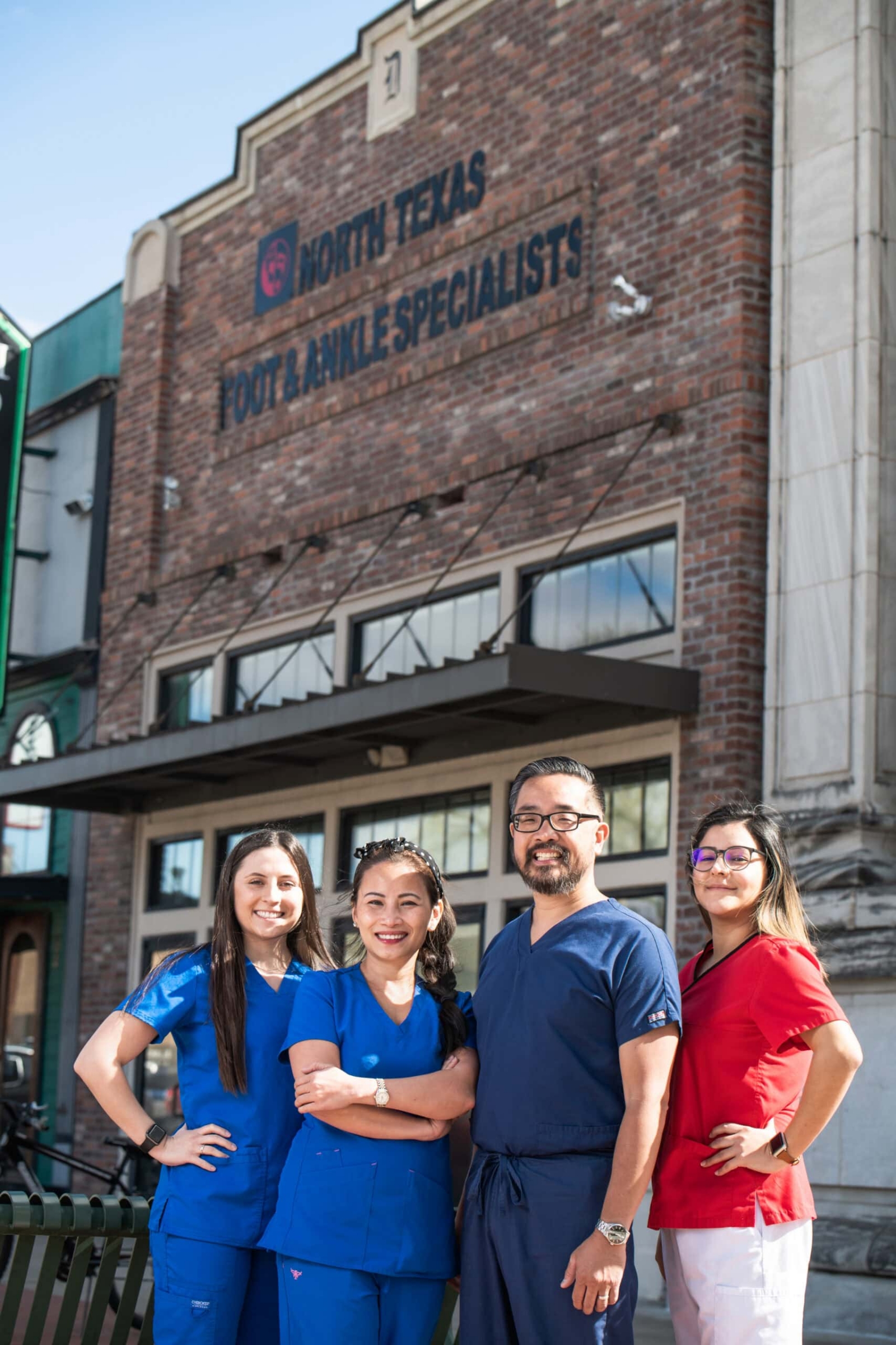 Practice team photographed together in scrubs, team and staff photography for dental practices in Dallas, Texas by David Loi Studios