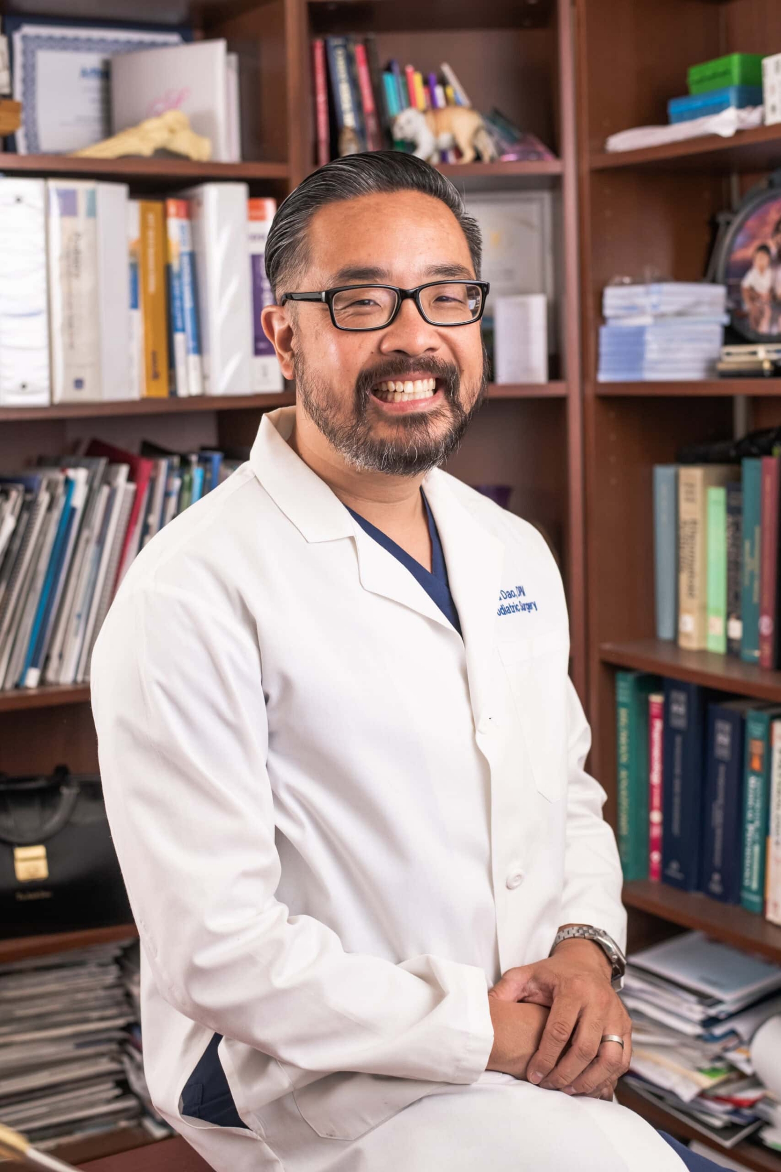 Pediatric surgeon photographed in a white coat, physician portrait commercial medical photography in Dallas, Texas by David Loi Studios