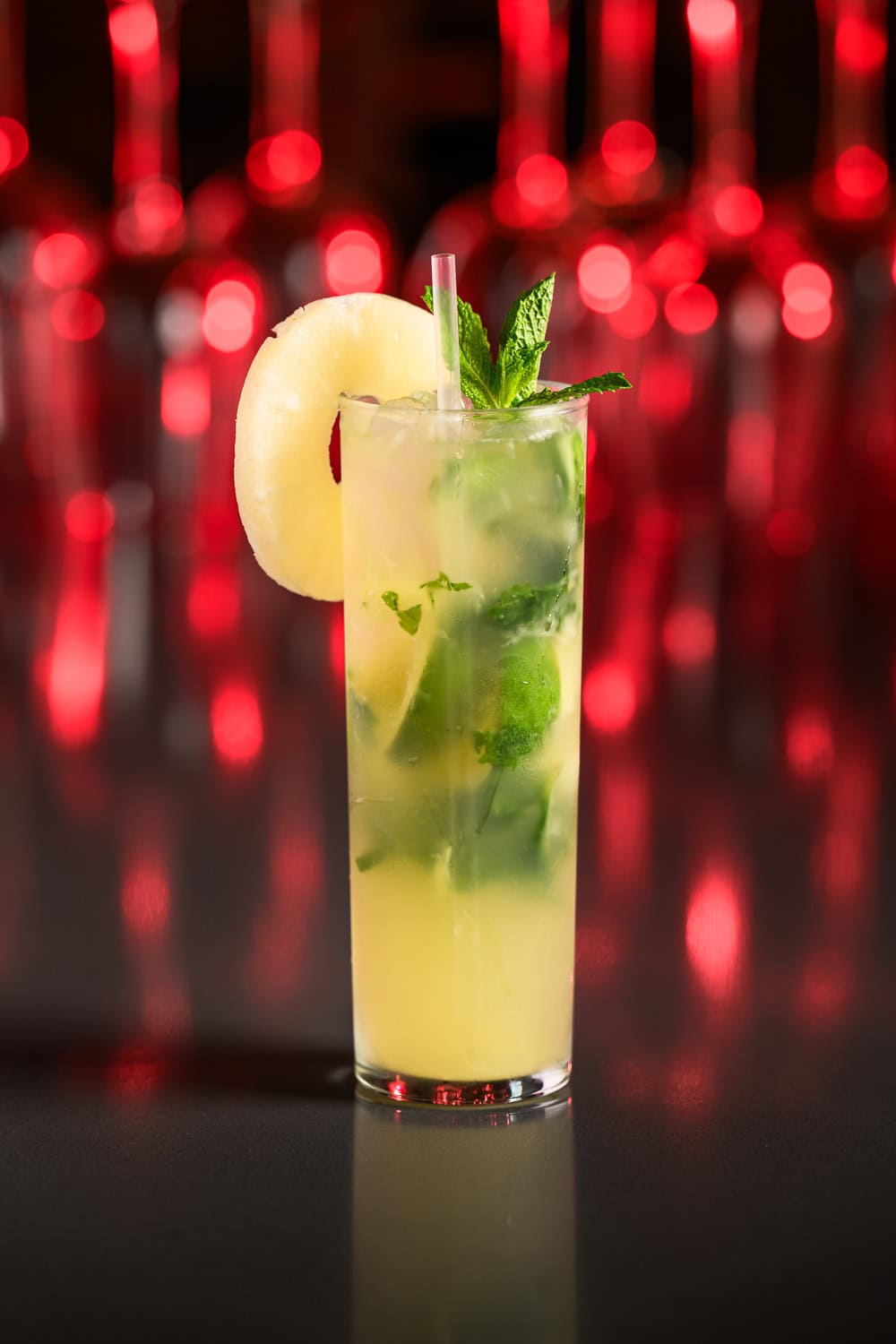 Pineapple mint mojito cocktail with fresh garnish, commercial beverage photography Dallas, Texas