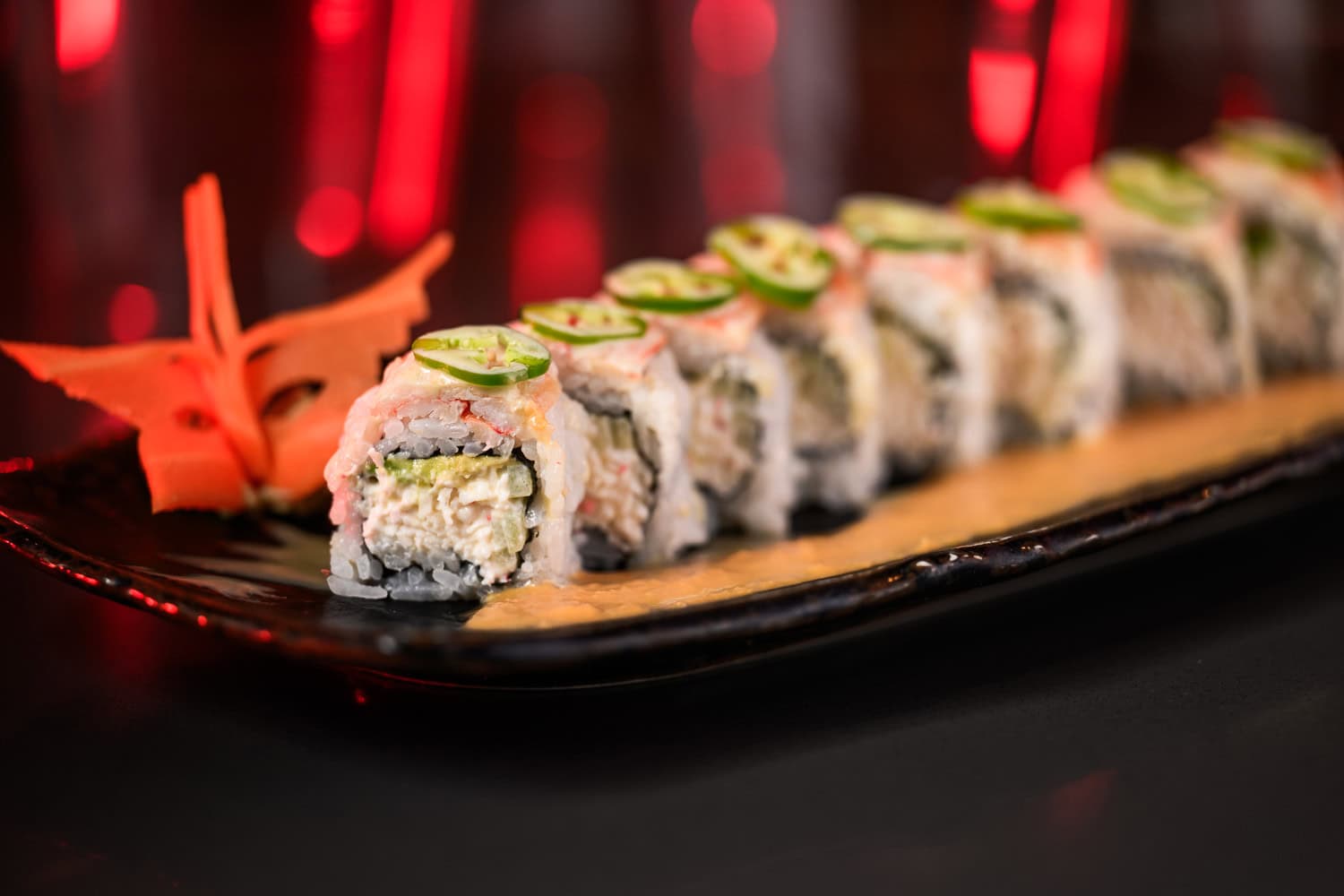 Sushi roll platter with jalapeño garnish, commercial food photography by David Loi Studios