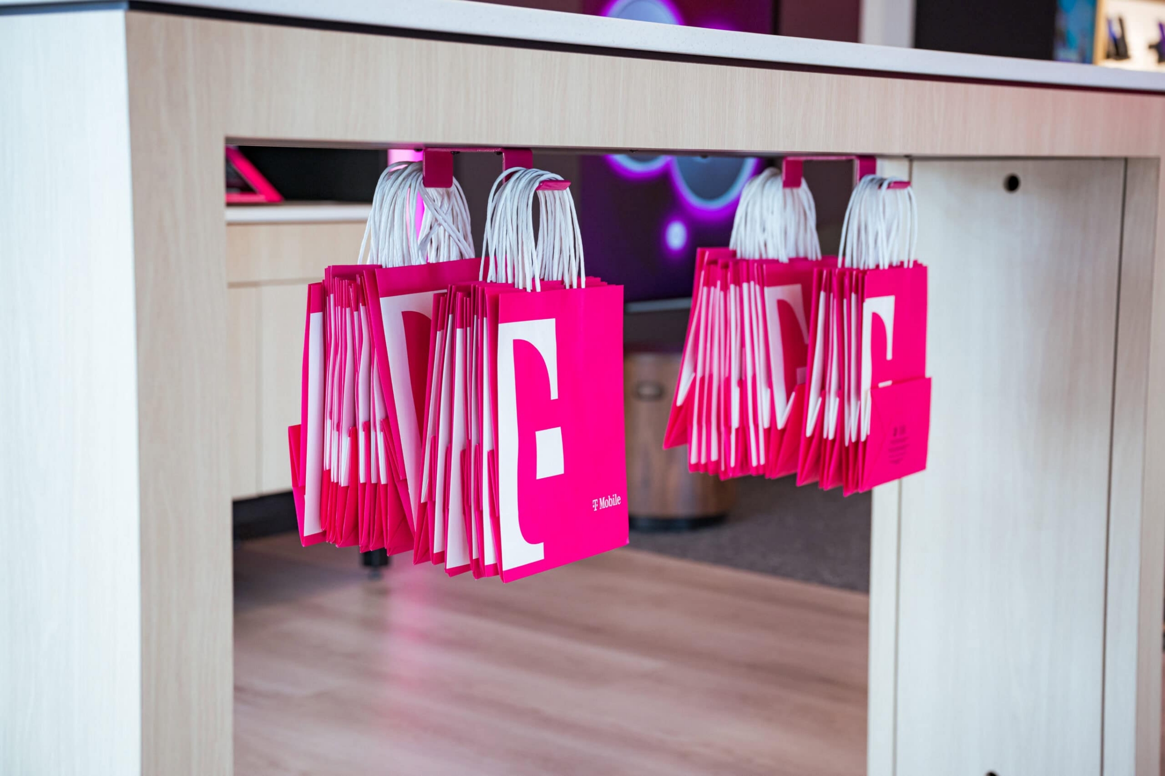 Branded retail shopping bags under a store counter, product-in-use and retail lifestyle photography in Dallas, Texas by David Loi Studios