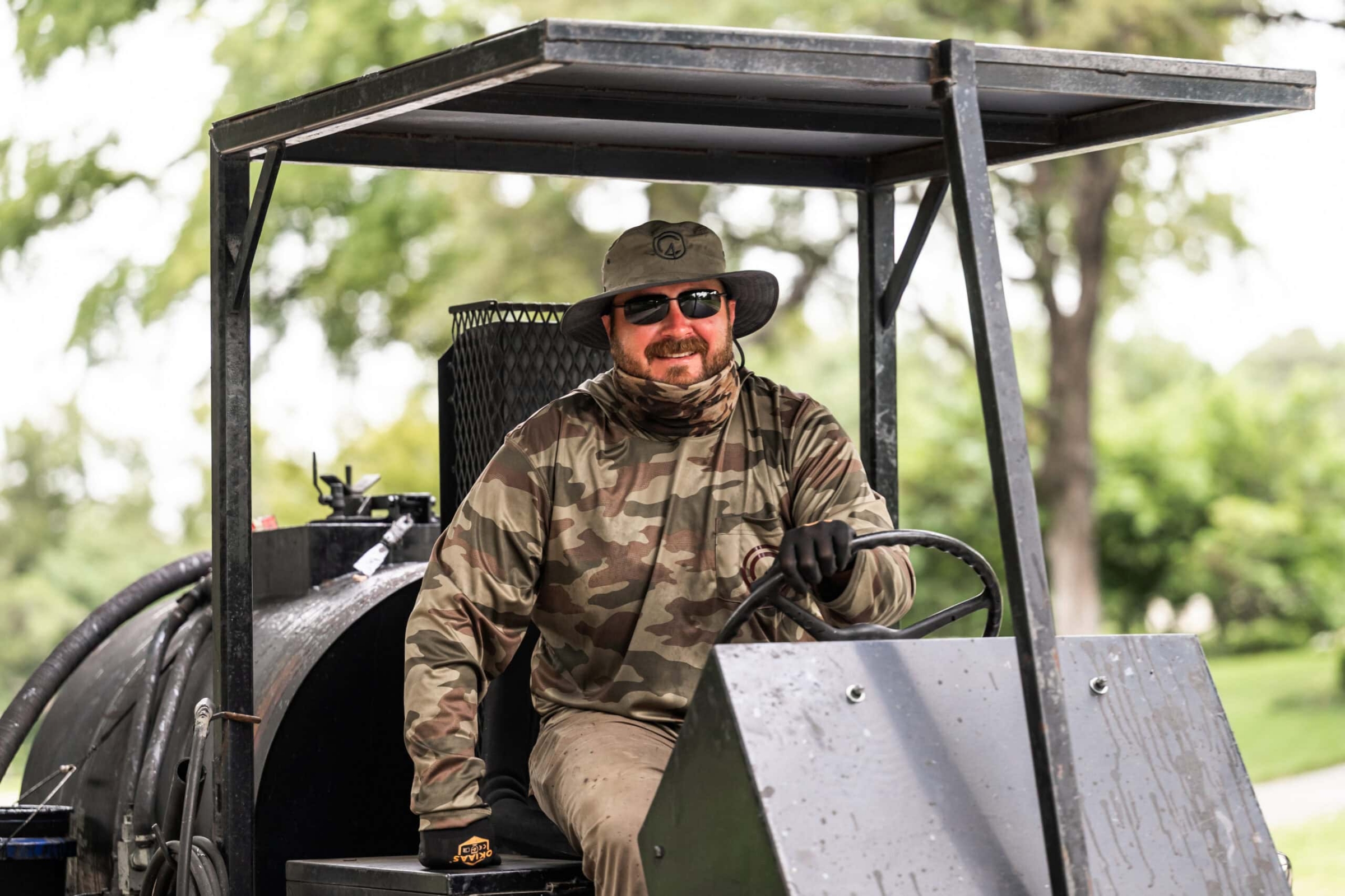 Equipment operator on industrial machinery, commercial photography by David Loi Studios